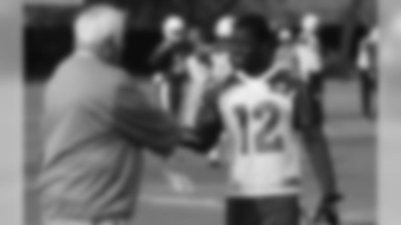 WR John Brown talks with assistant head coach Tom Moore