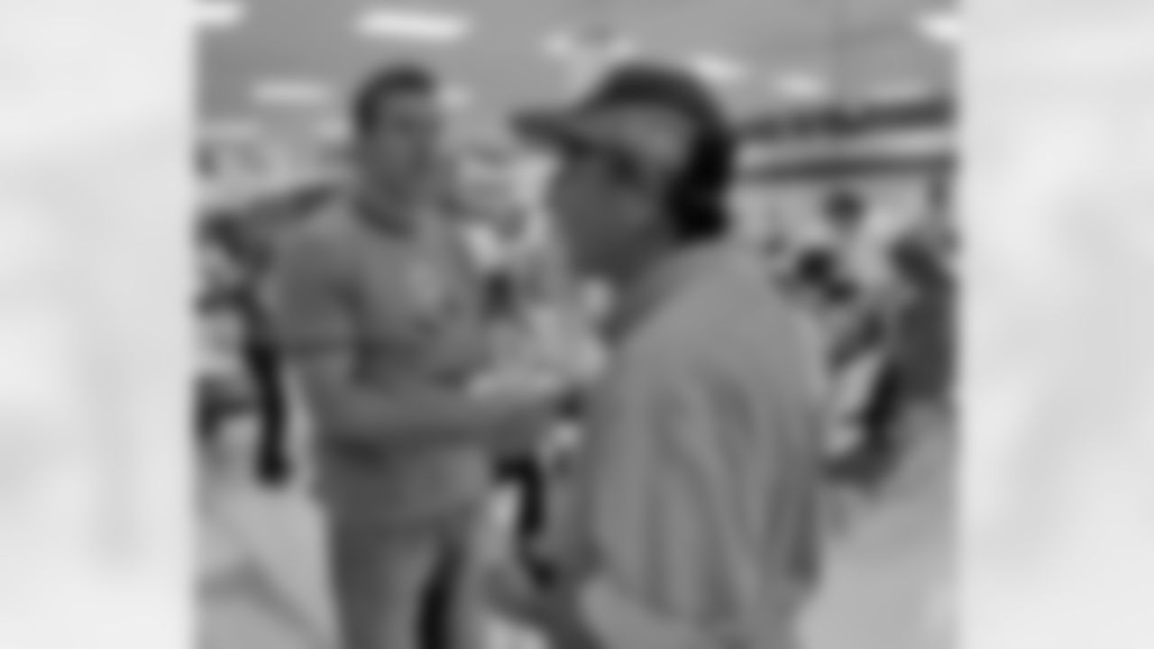 Kurt shakes the hand of a volunteer