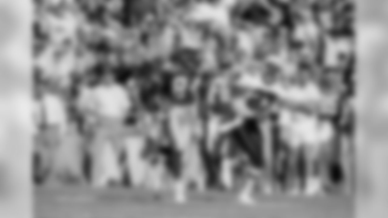 Green Bay Packers wide receiver Sterling Sharpe (84), chased by Phoenix Cardinals Jay Taylor, heads towards the goal line to score the first touchdown in their game in Tempe, Nov. 18, 1990.