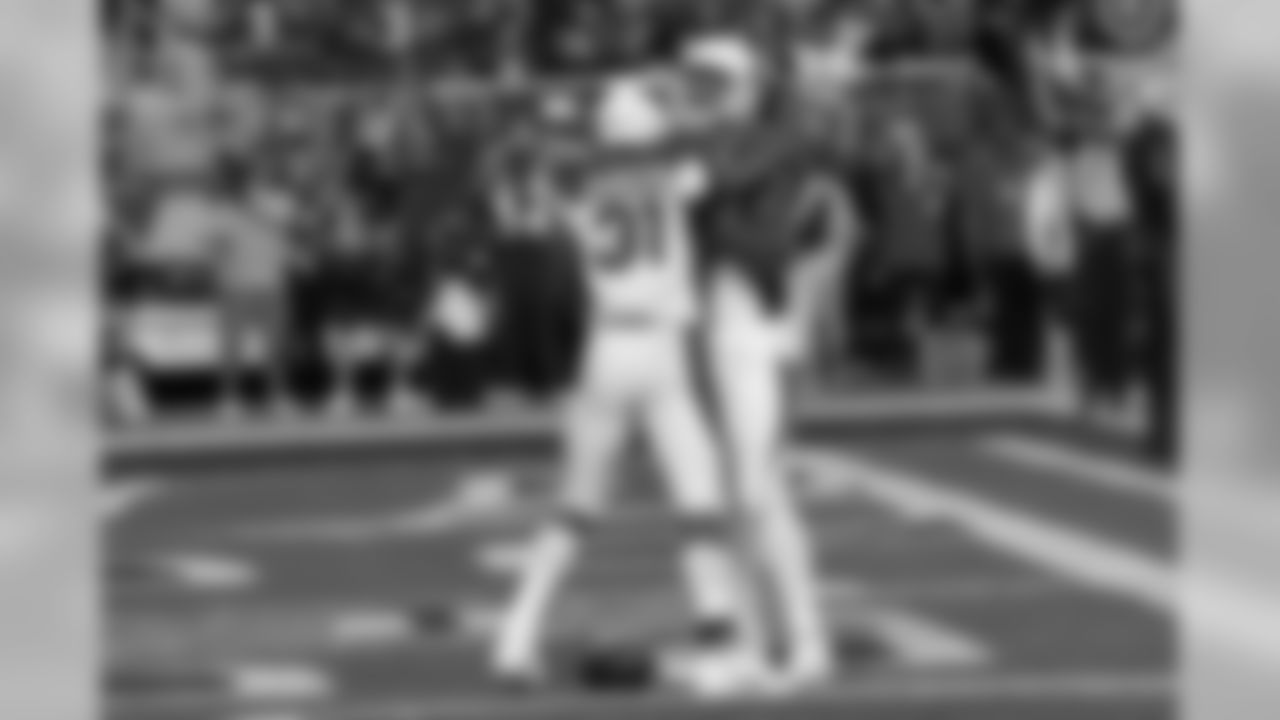 OT D.J. Humphries congratulates RB David Johnson after a touchdown against the 49ers