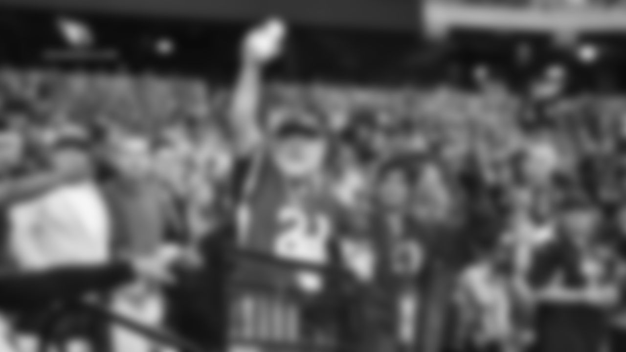 Images of Cardinals fans at State Farm Stadium last season