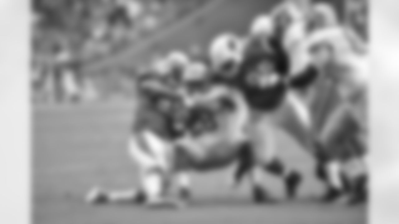 DT Frostee Rucker (left) and DT Rodney Gunter combine on a tackle