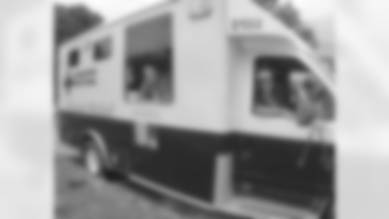 Kurt and Brenda Warner in the Red Cross vehicle