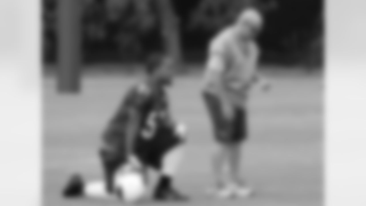 LB Kevin Minter (left) with assistant DB coach Mike Chiurco