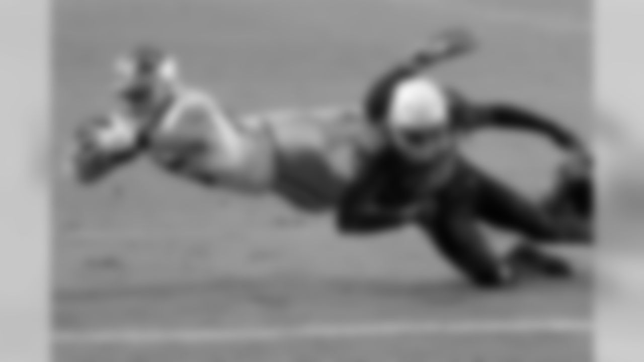 49ers tight end George Kittle is tackled short of the goal line by Cardinals safety Deionte Thompson.