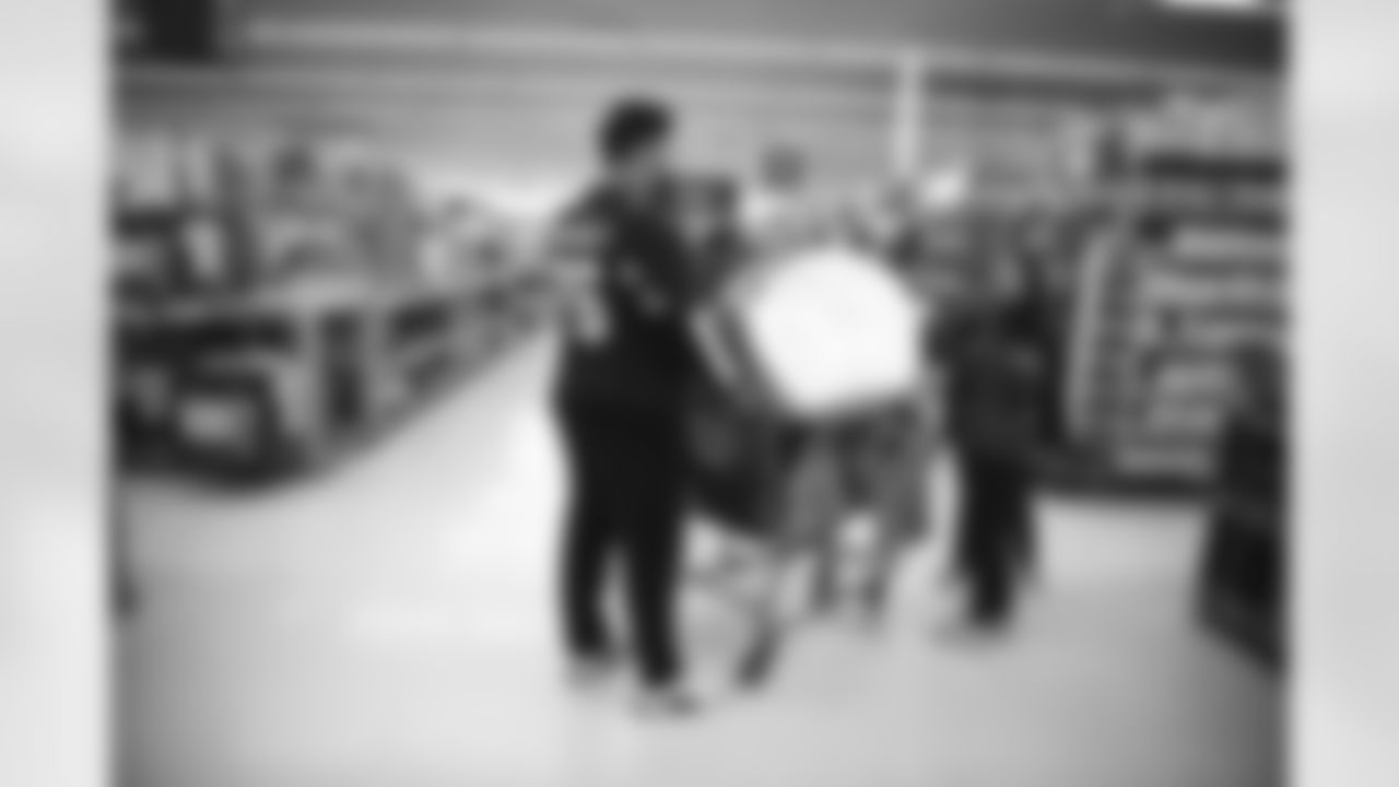 The Arizona Cardinals participate in Shop With A Jock with Desert Financial Credit Union at Walmart on Tuesday, December 13, 2022 in Tempe, AZ.