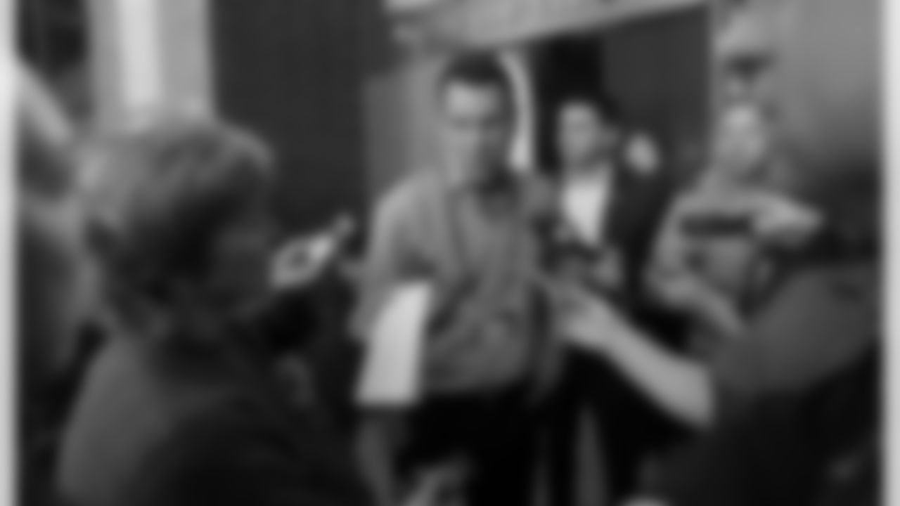 Broncos coach Gary Kubiak speaks with reporters