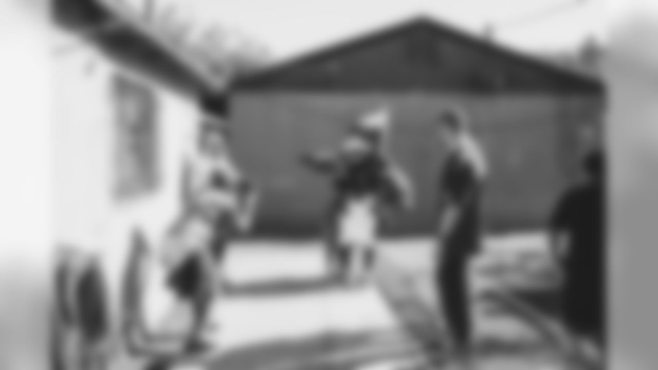 WR KeeSean Johnson, K Zane Gonzalez and other members of the organization visited domestic violence victims and their families on Tuesday