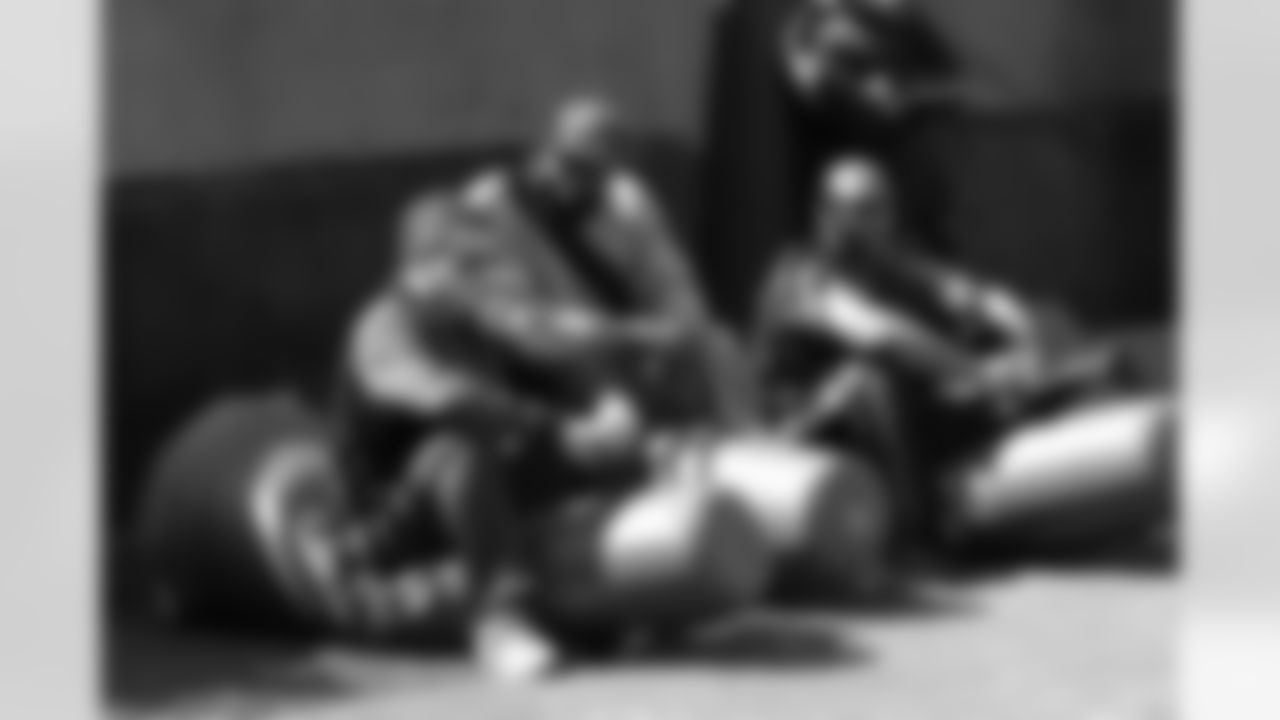 Cardinals coaches Nick Rapone, Brentson Buckner and Mike Caldwell take a break