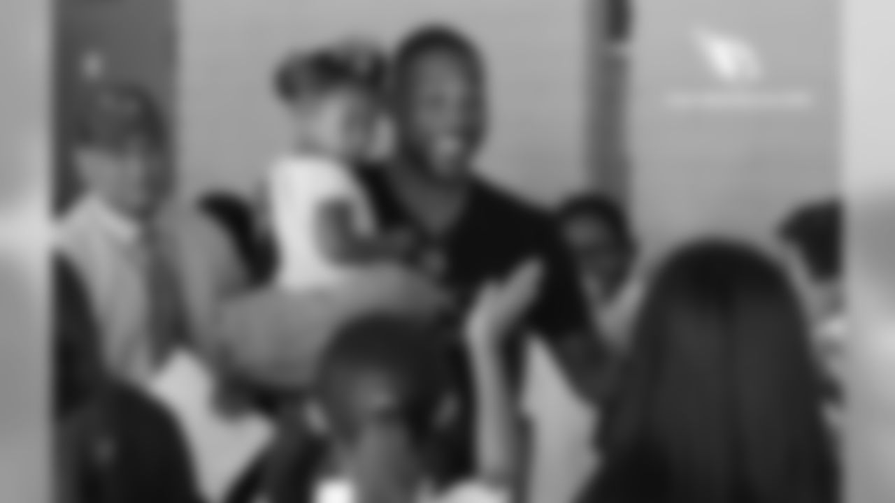 CB Patrick Peterson hangs out with the students while holding his daughter, Paityn