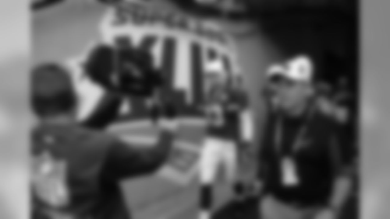 Warner is filmed walking out of the tunnel before the Super Bowl