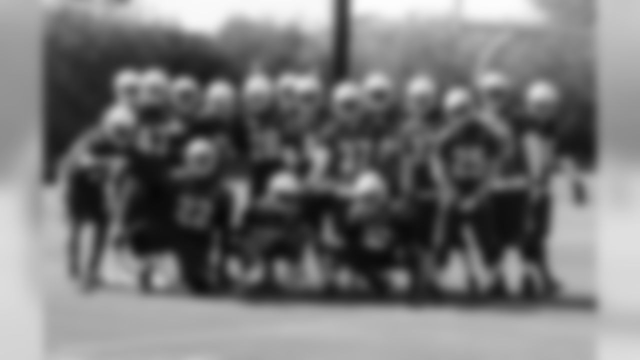 The defensive backs pose for a photo