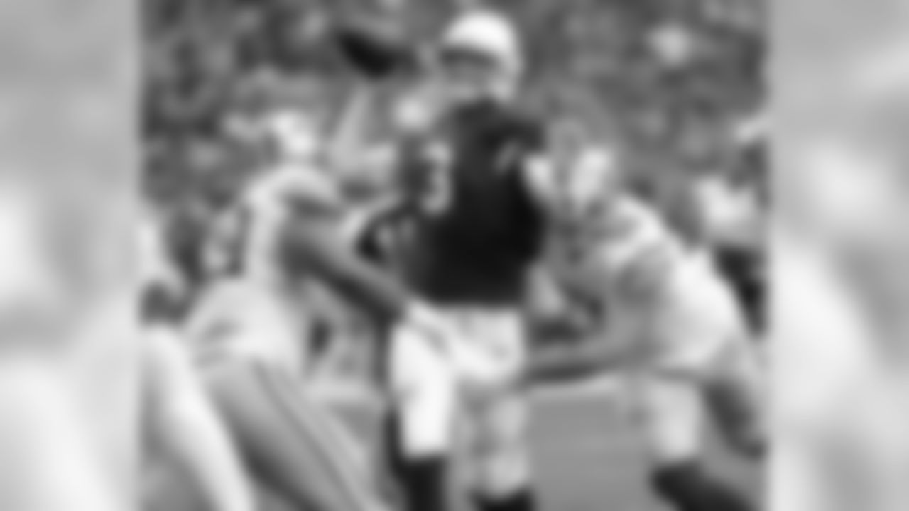 QB Carson Palmer throws an interception under pressure