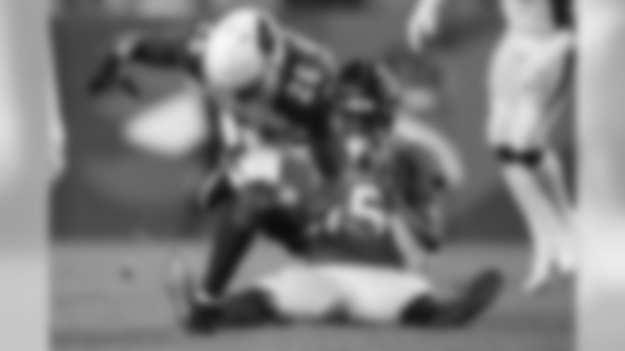 Arizona Cardinals cornerback Brandon Williams (26) intercepts a pass intended for Denver Broncos wide receiver Juwann Winfree (15).