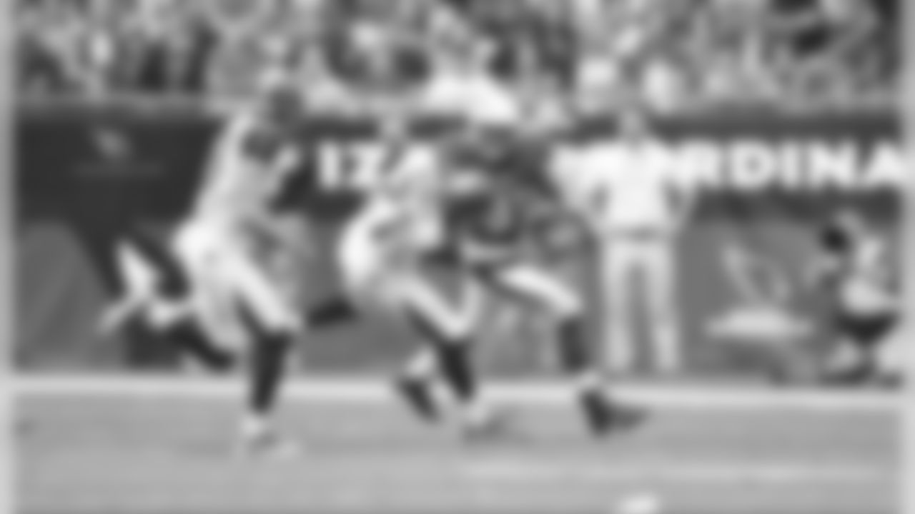 Johnson stiff-arms a Tampa Bay defender
