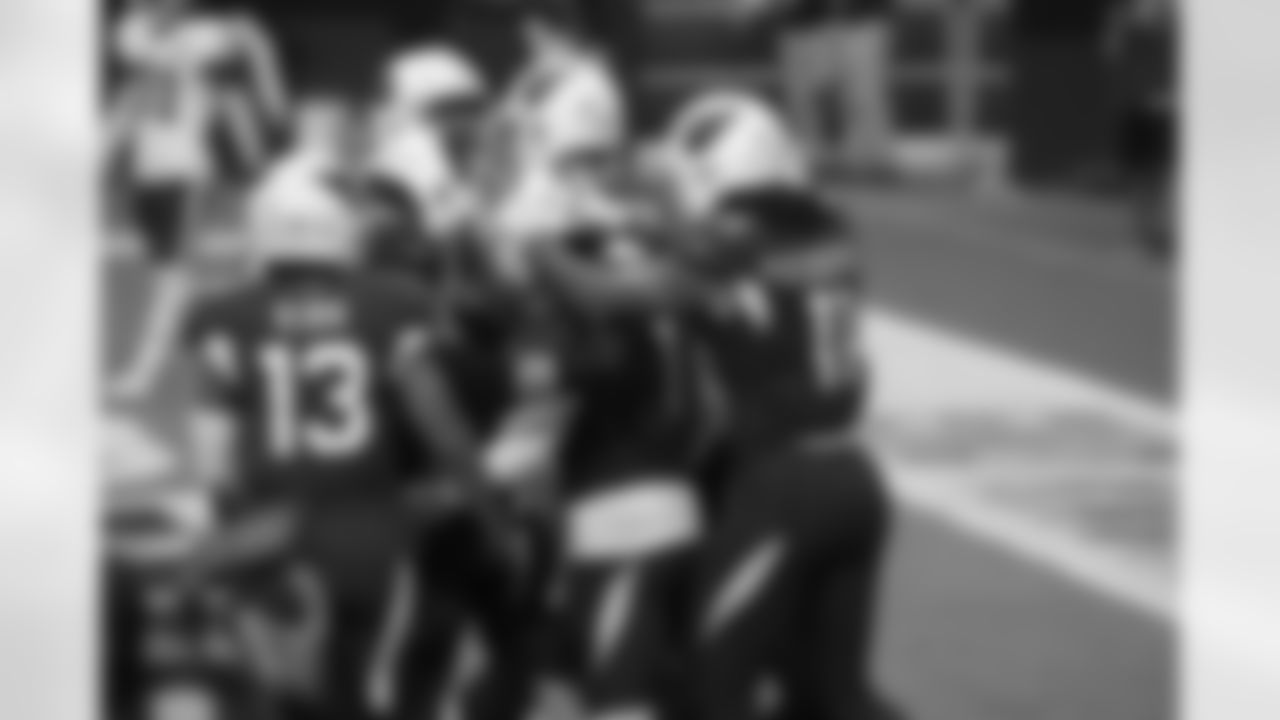 Kyler Murray celebrates a touchdown with teammates