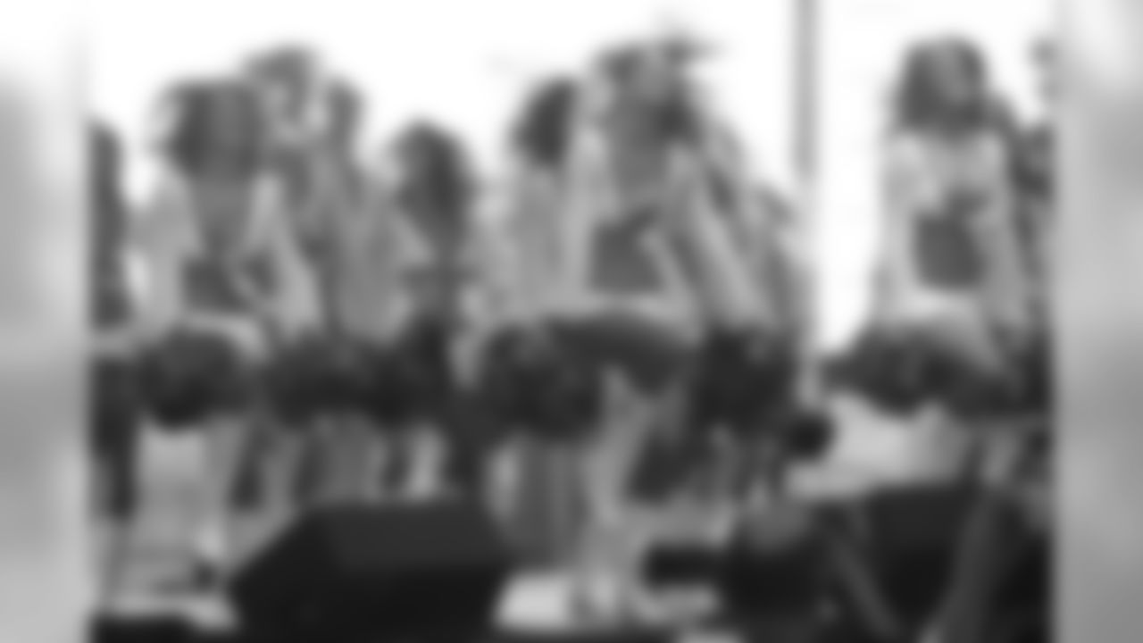 The cheerleaders perform.