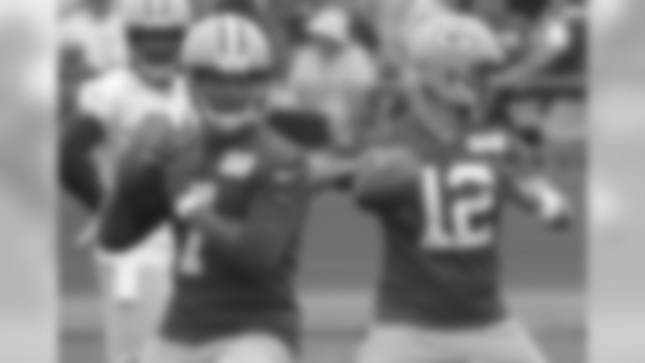 Green Bay Packers' Green Bay Packers' Aaron Rodgers and Brett Hundley throw during NFL football training camp Thursday, July 26, 2018, in Green Bay, Wis.