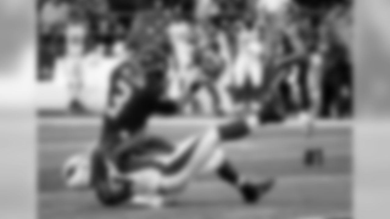 LB Sio Moore brings down QB Russell Wilson. The Cardinals put pressure on the Seahawks quarterback with a total of six sacks in the game.
