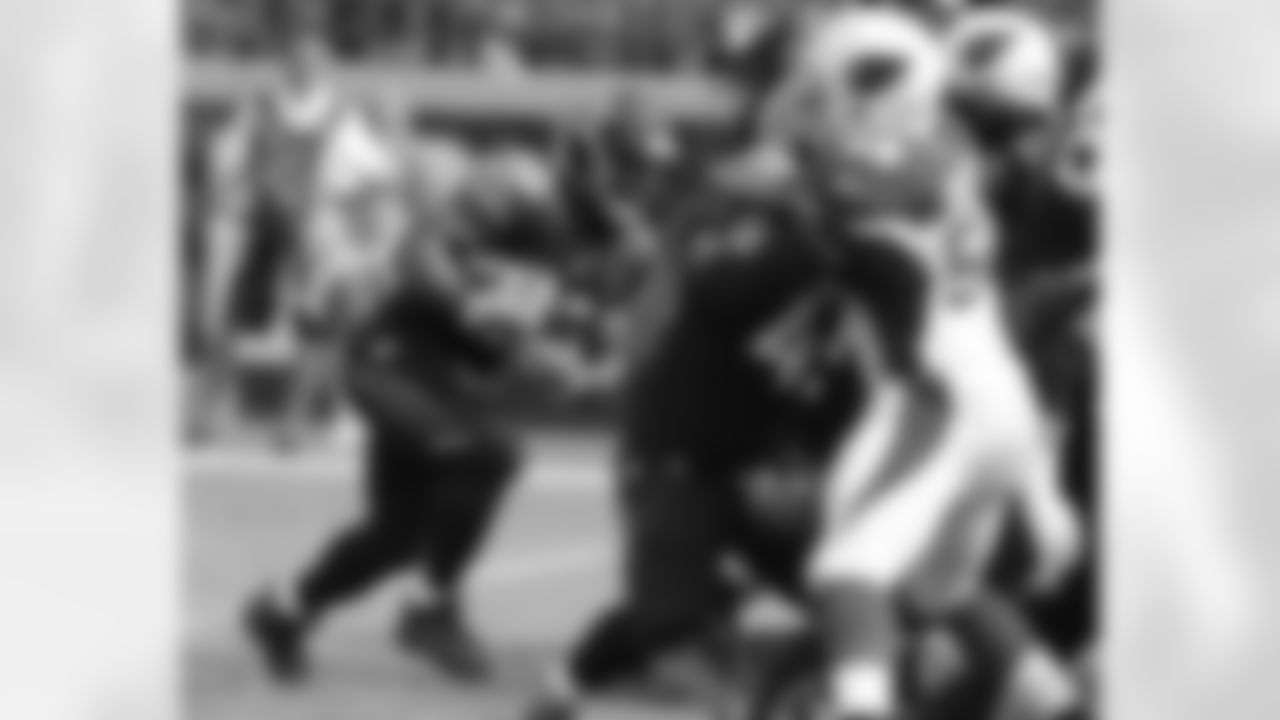 Maurice Jones-Drew looks for a hole against the Cardinals' defensive line.