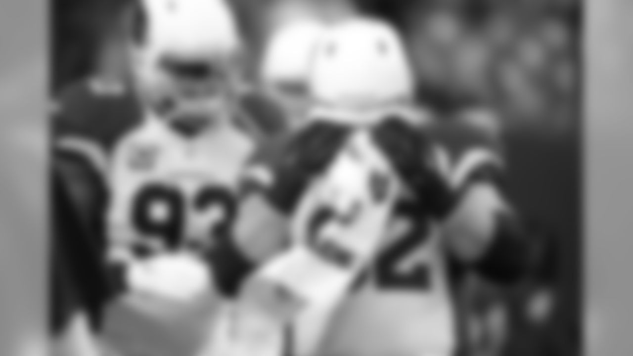 G Ted Larsen wipes his face before the game