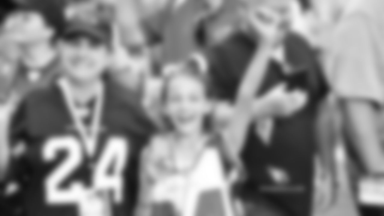 Images of Cardinals fans at State Farm Stadium last season