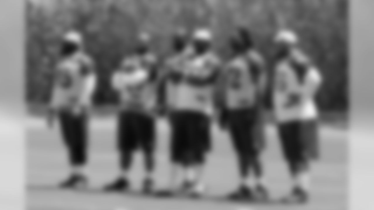 The reserve defensive linemen watch the play
