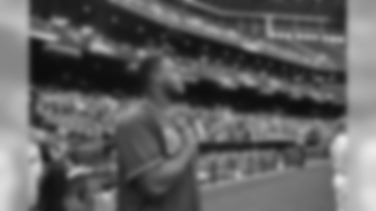 T D.J. Humphries stands for the National Anthem