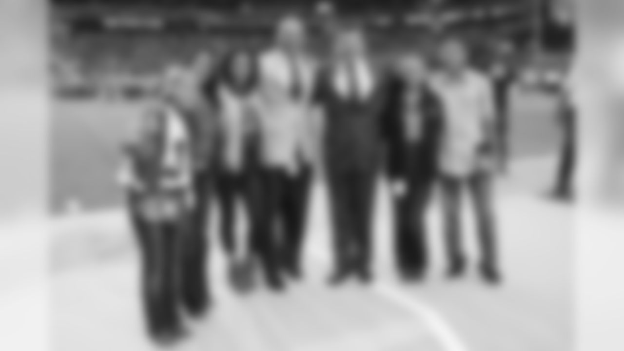 Aeneas Williams with his family and team president Michael Bidwill before the game