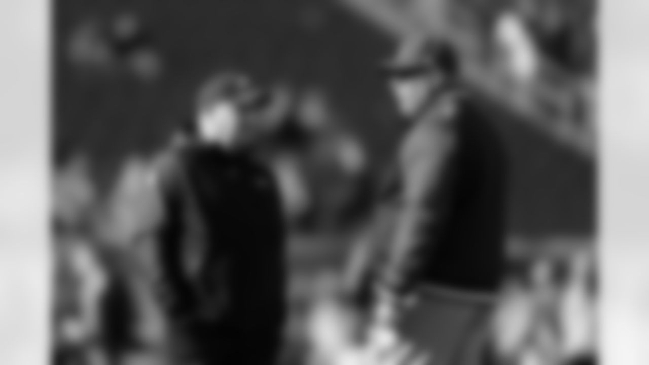 Bruce Arians and Chip Kelly chat before the game.