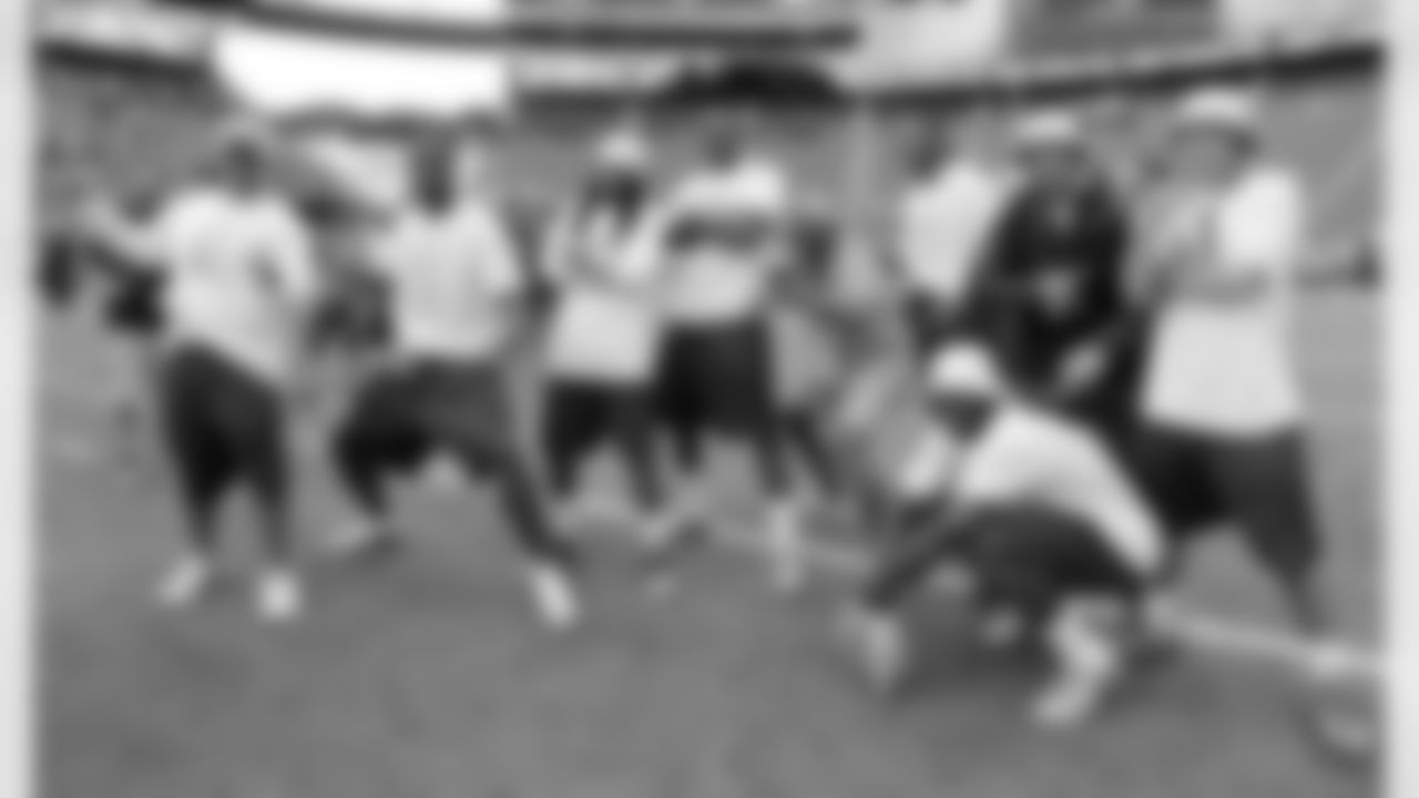 Among those posing during the day-before workout are (left to right) Bears wide receiver Brandon Marshall, Chiefs punt returner Dexter McCluster, Bears wide receiver Alshon Jeffery, Hall of Fame wide receiver Jerry Rice, Cardinals wide receiver Larry Fitzgerald and Browns wide receiver Josh Gordon