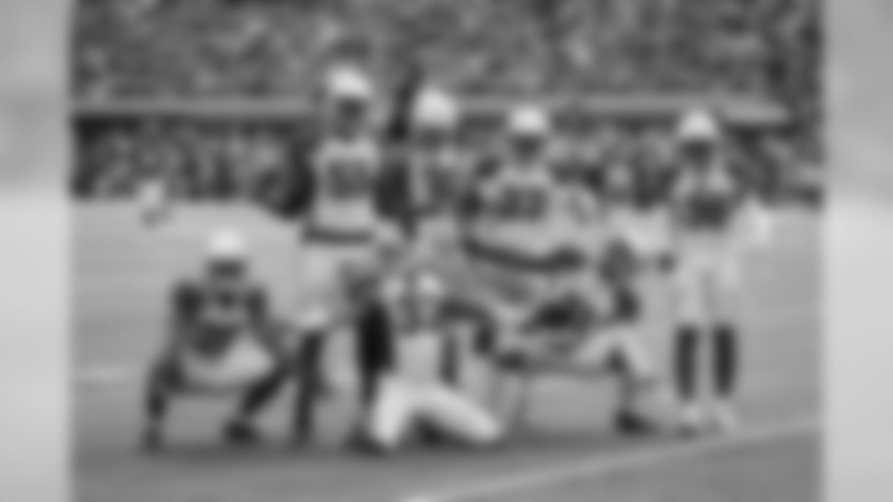 The Cardinals defense celebrates after a strip sack leads to a touchdown