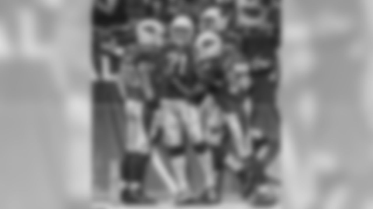 The defense celebrates a Peterson interception