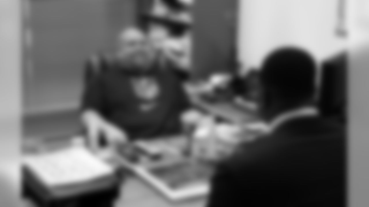GM Steve Keim has a laugh with his new player