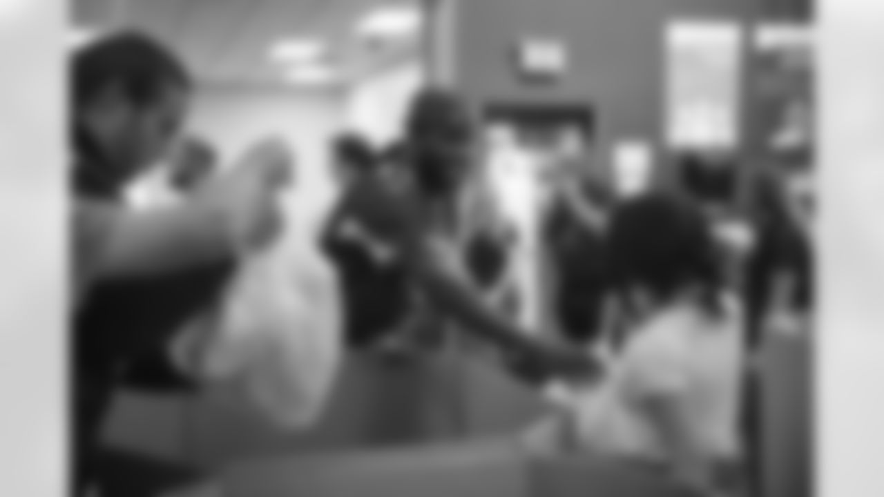 The Arizona Cardinals and Verizon help pack bags of food at United Food Bank on Tuesday, April 4, 2023 in Mesa, AZ.