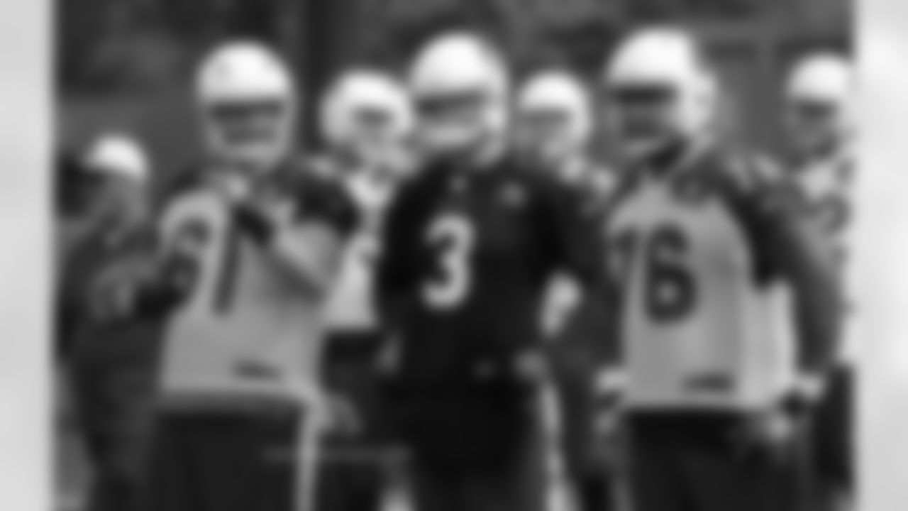 OL Cole Toner (61), QB Carson Palmer (3) and G Mike Iupati (76)