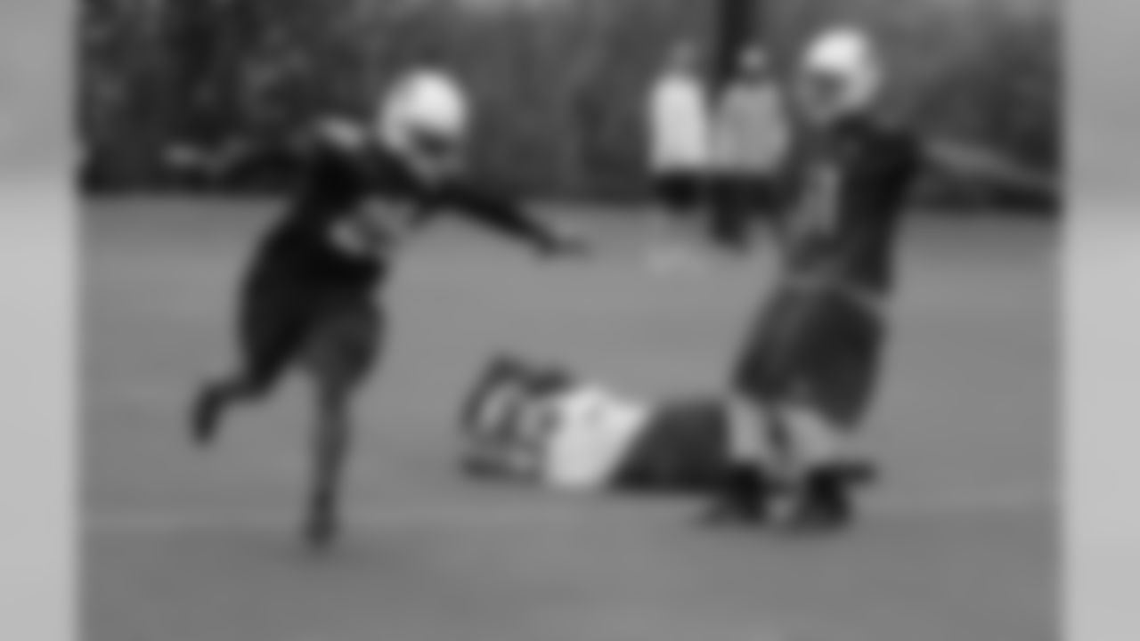 CB Jerraud Powers (left) and LB Kevin Minter signal incomplete