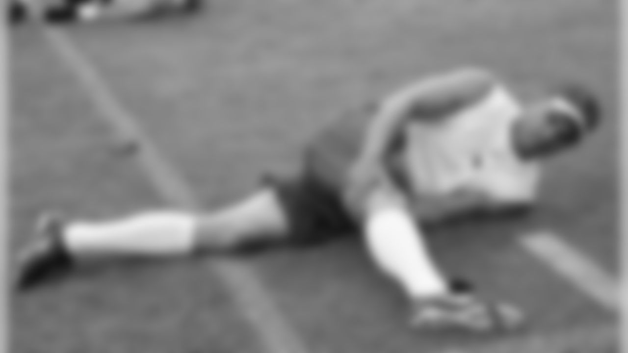 Kicker Neil Rackers stretches prior to Run Test