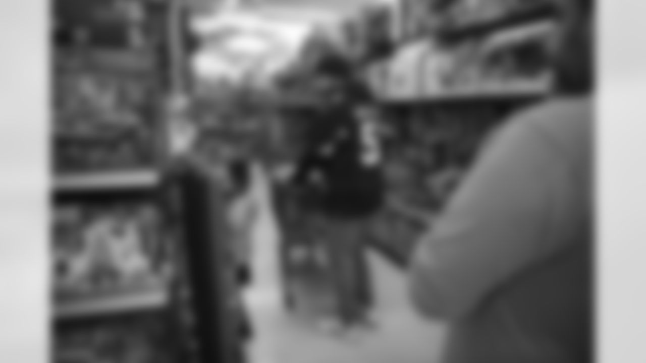 The Arizona Cardinals participate in Shop With A Jock with Desert Financial Credit Union at Walmart on Tuesday, December 13, 2022 in Tempe, AZ.
