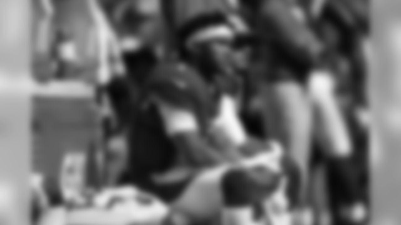 Kyler Murray sits on the Cardinals sideline in the second half.