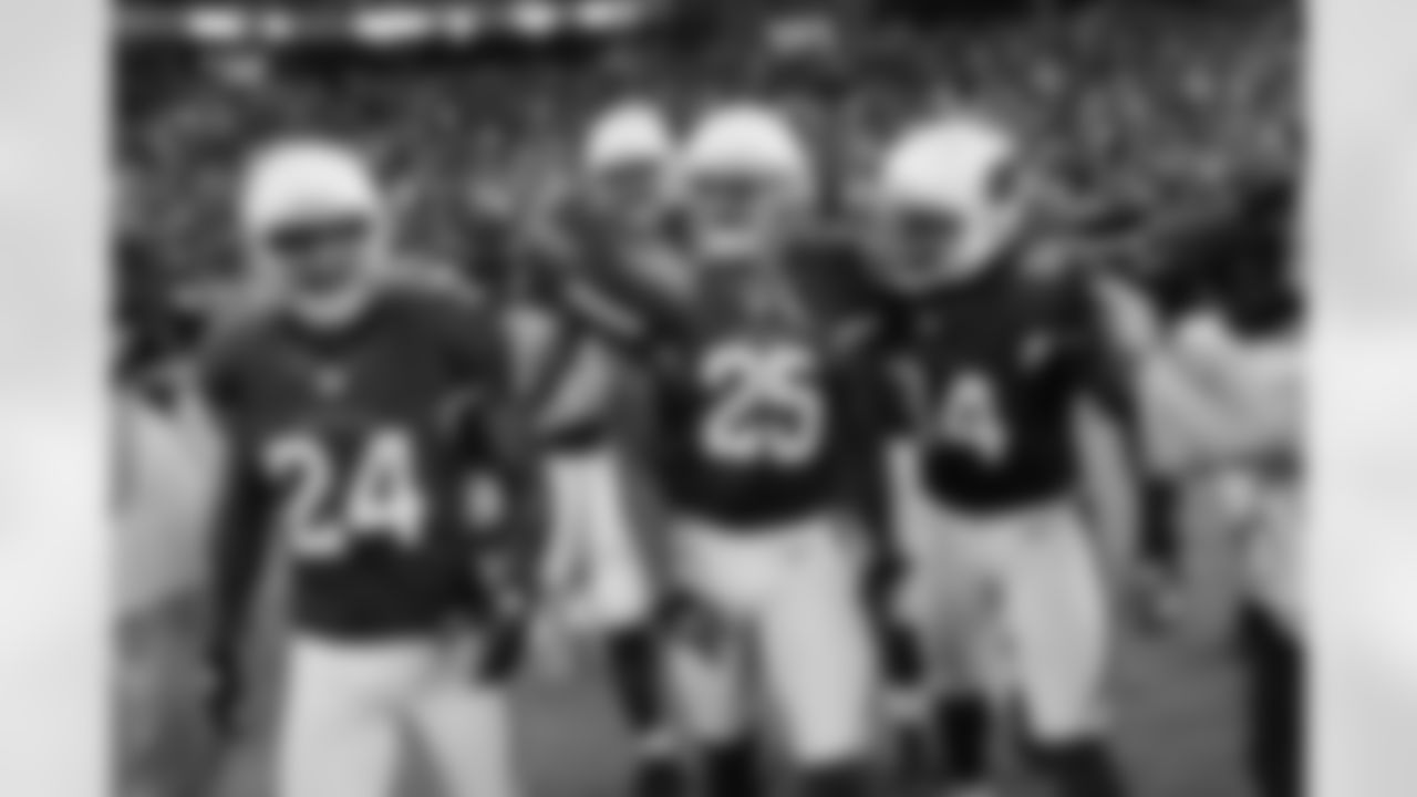 Rhodes celebrates the interception with teammates