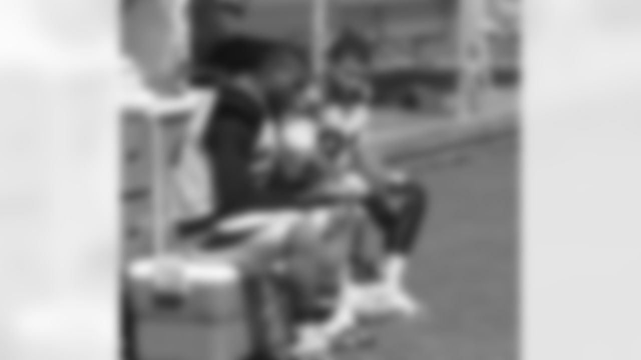 CB Patrick Peterson (left) and S Tyrann Mathieu wait for practice to begin