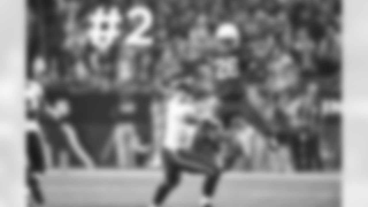 S Rashad Johnson jumps toward Seahawks QB Russell Wilson