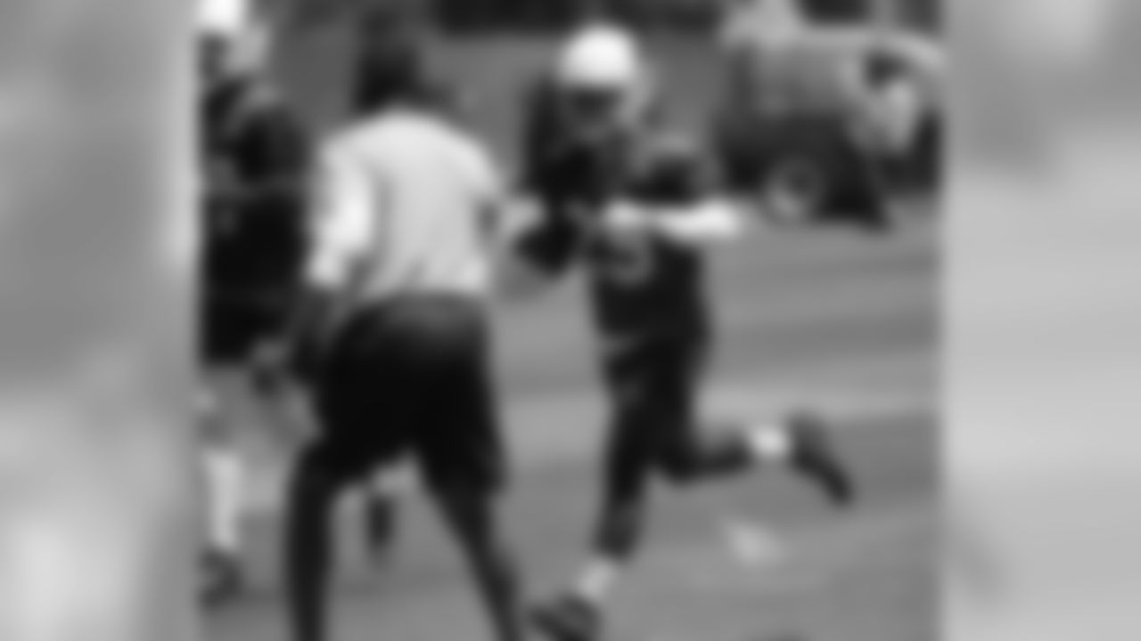 RB Chase Edmonds gets a fist bump from coach Steve Wilks