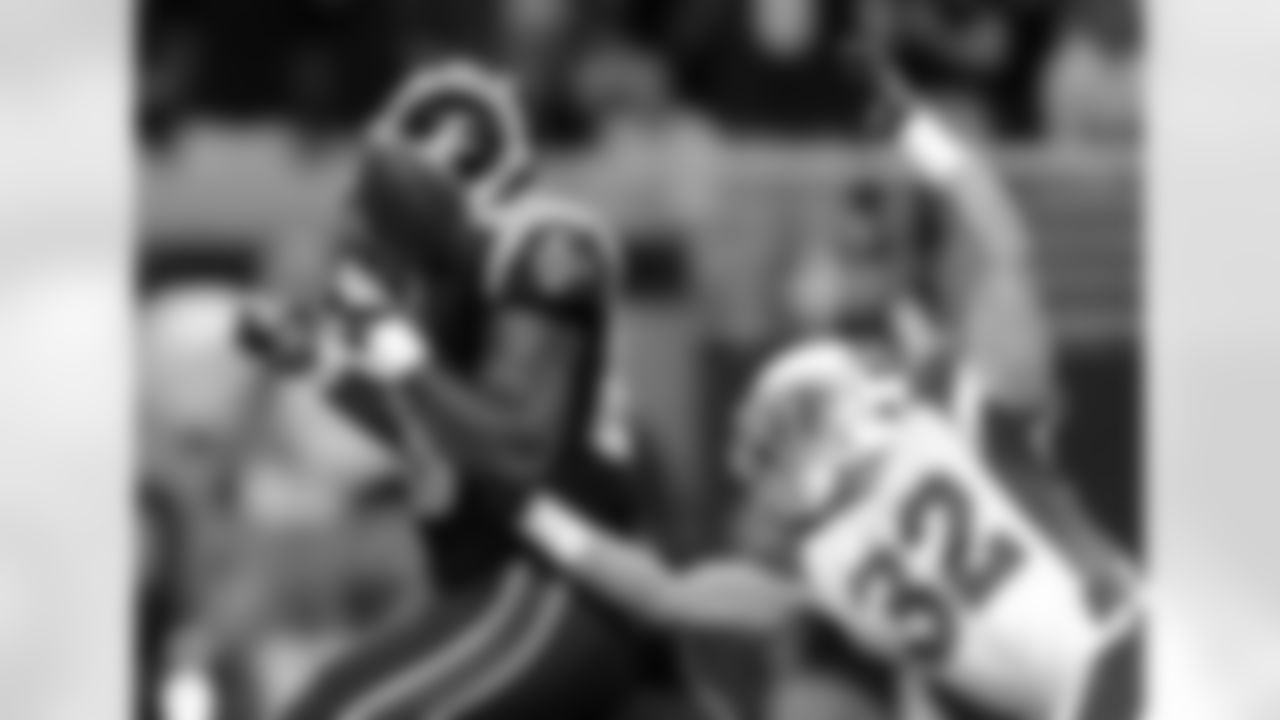 S Tyrann Mathieu pops the ball loose from Rams TE Jared Cook near the goal-line.