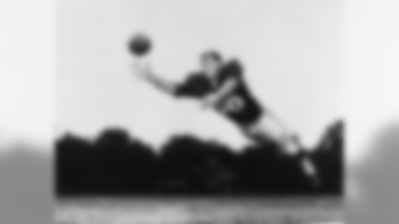 TE Sonny Randle diving for a pass at training camp in Lake Forest, Ill. in 1960