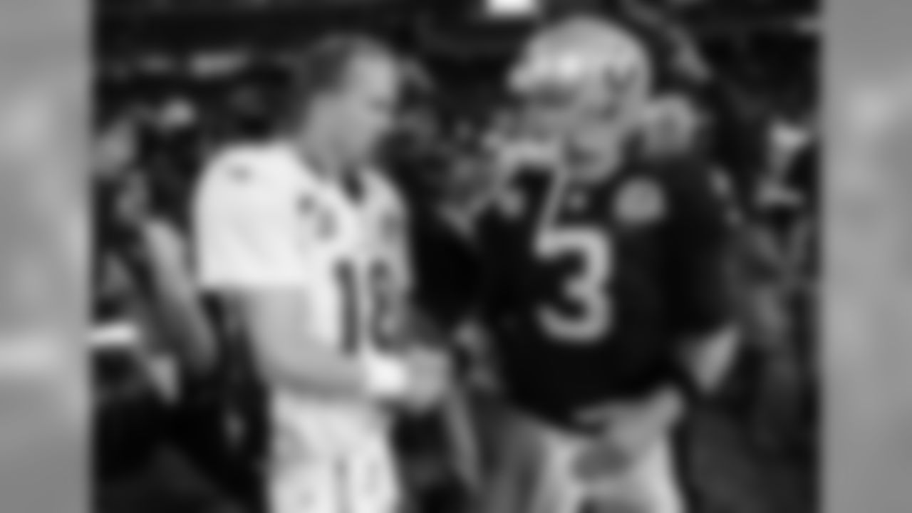 Palmer with Broncos QB Peyton Manning in 2012