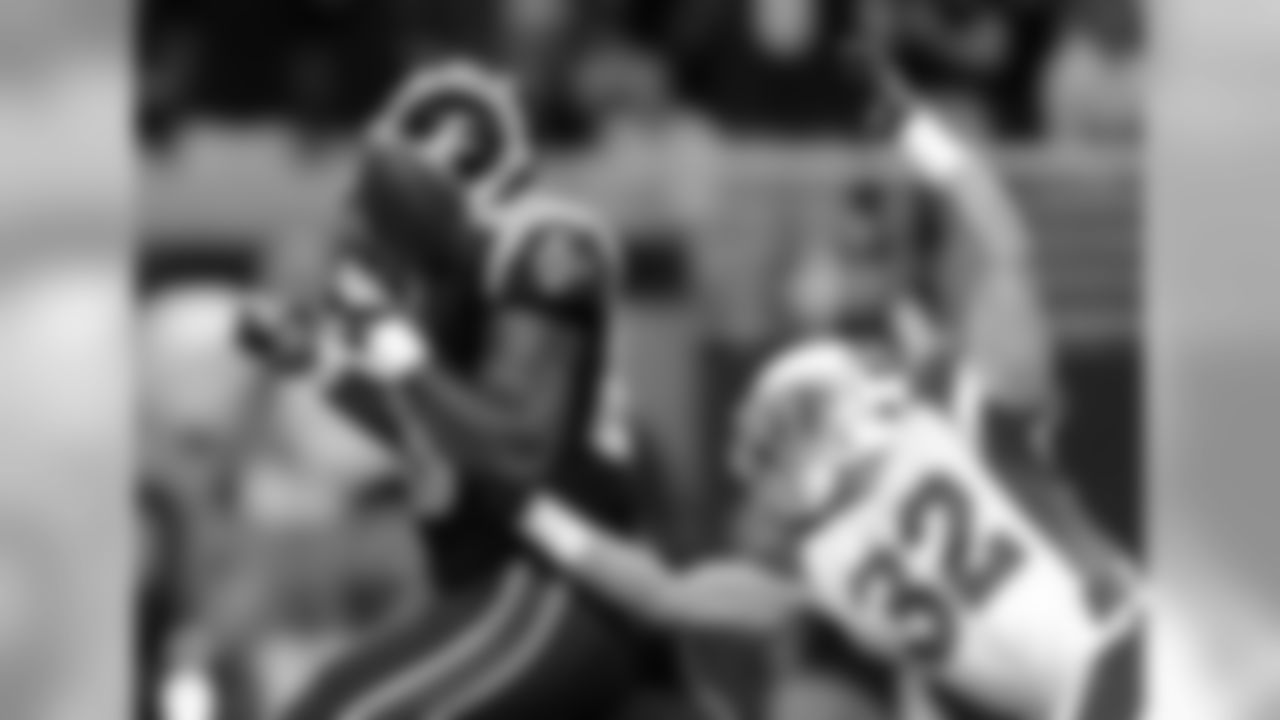 Week 1: S Tyrann Mathieu pokes the ball away from Jared Cook near the goal-line.