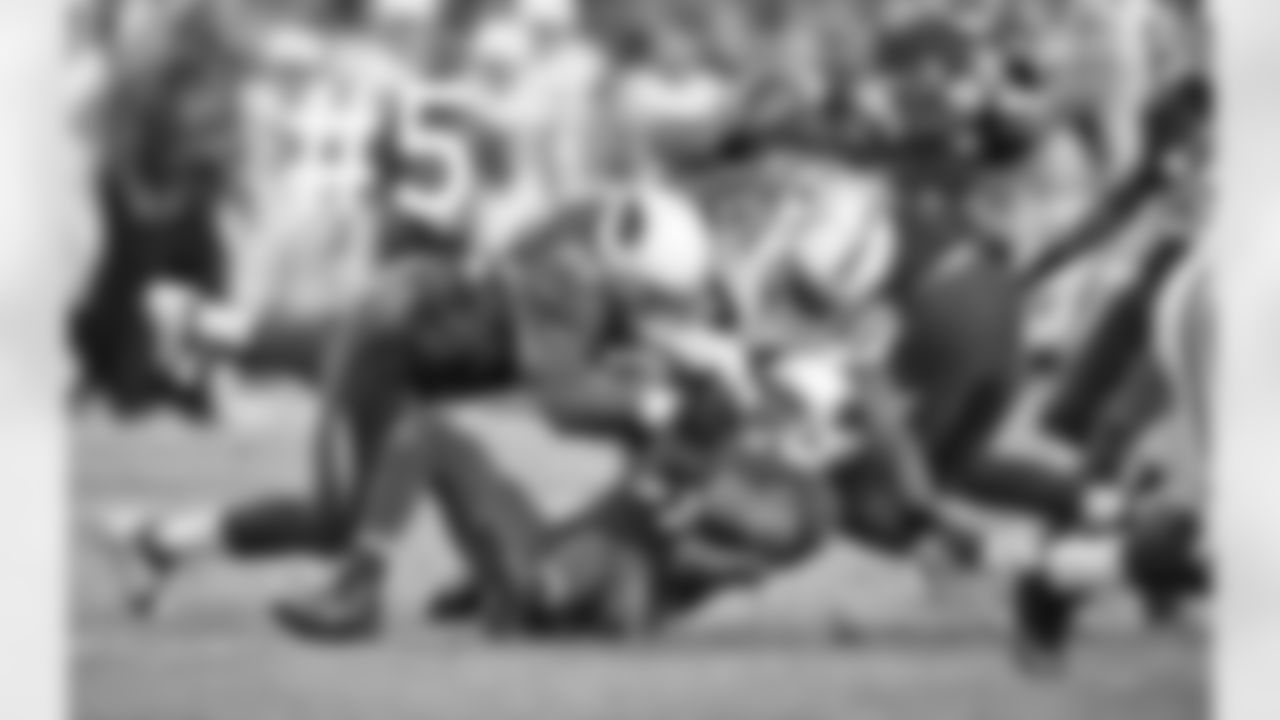 The ball pops out from the grasp of Trent Richardson.
