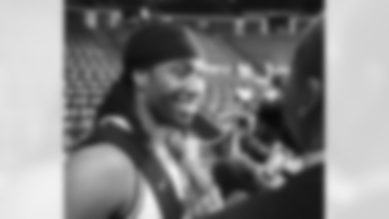 Larry Fitzgerald talks to reporters